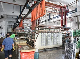 Workers operating electroplating machines for towel warmers