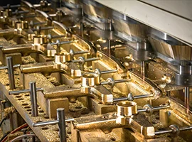 Faucet bodies being precisely machined in a production line