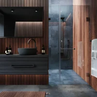 Modern bathroom with wooden paneling, vessel sink, and glass shower enclosure