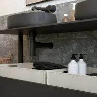 Close-up of black vessel sink with under-sink storage